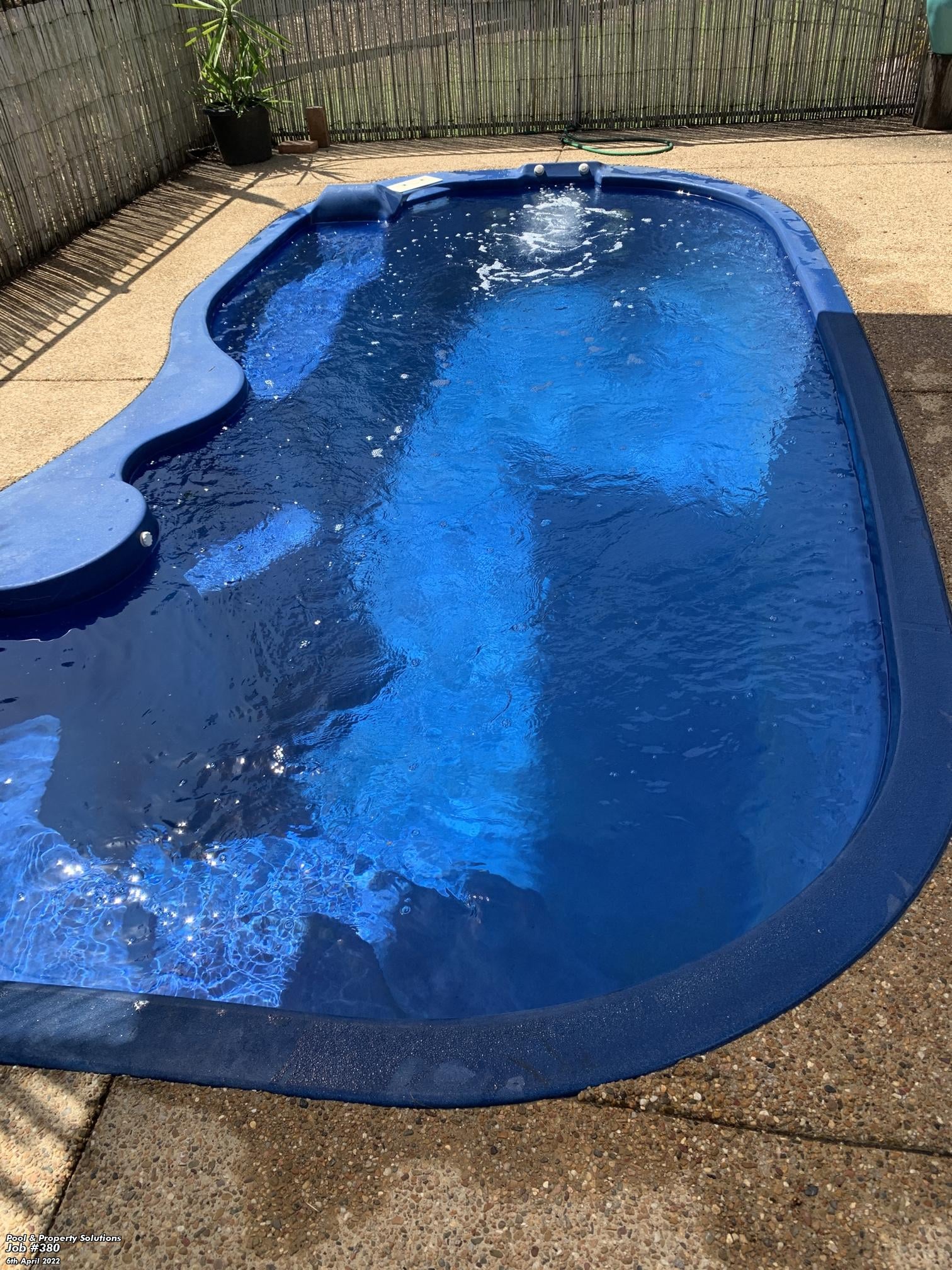 The same pool after rectification — clear blue water